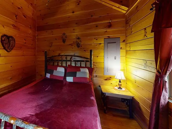Bedroom with lamp on stand