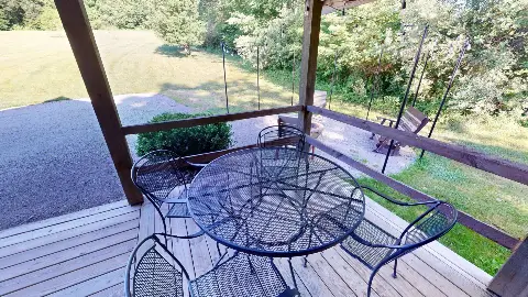Patio table overlooking the fire pit and yard