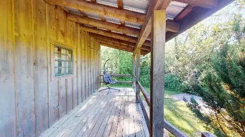 Side porch with hanging egg chair
