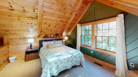 Loft bedroom with fern-print quilt