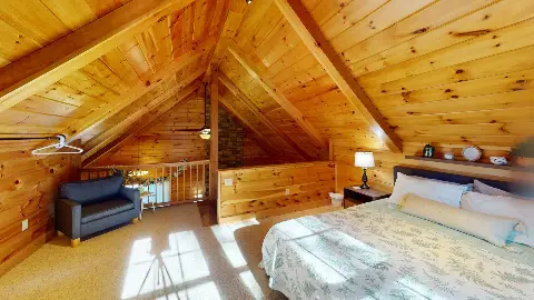 Loft with bed, armchair and railing