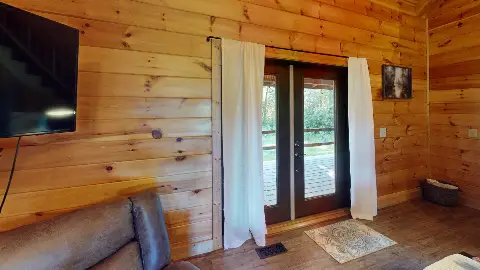 French doors from the living room to the back deck